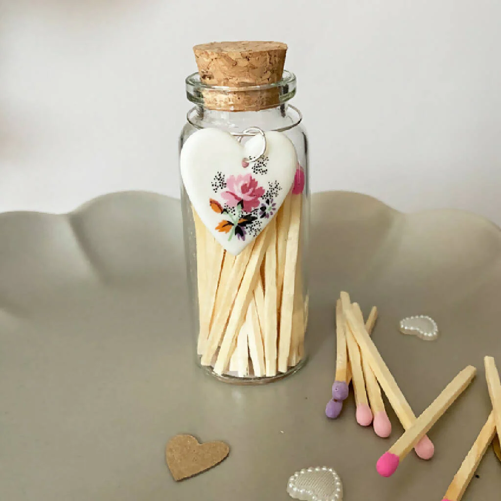 A Bottle Of Rose Matches And Porcelain Heart Charm - Image 2