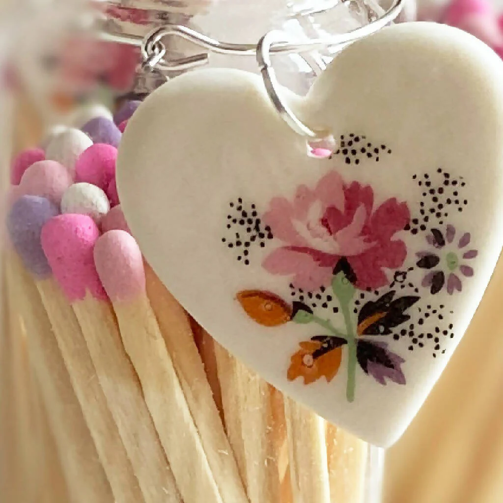 A Bottle Of Rose Matches And Porcelain Heart Charm - Image 3