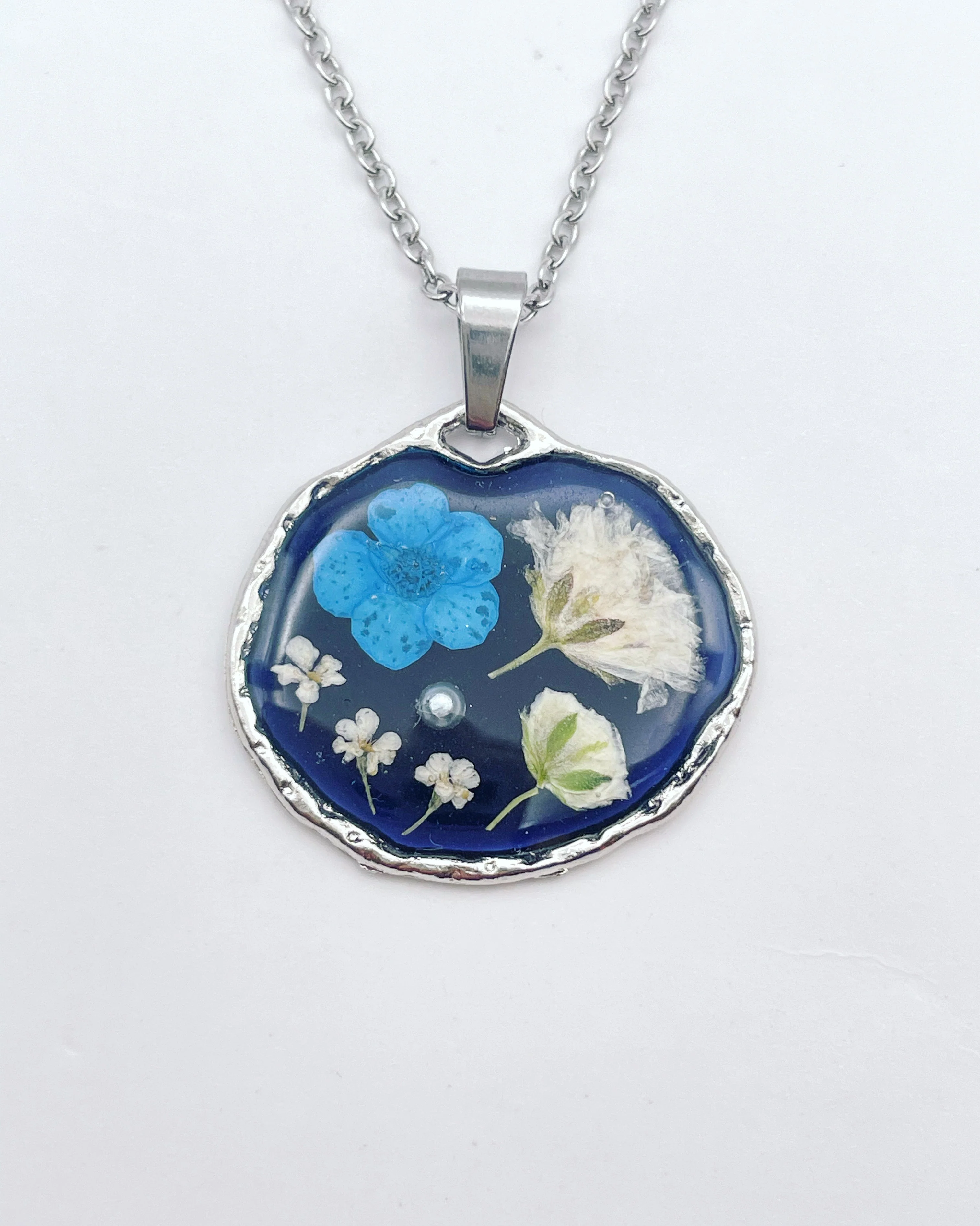 Black necklace with blue and white flowers