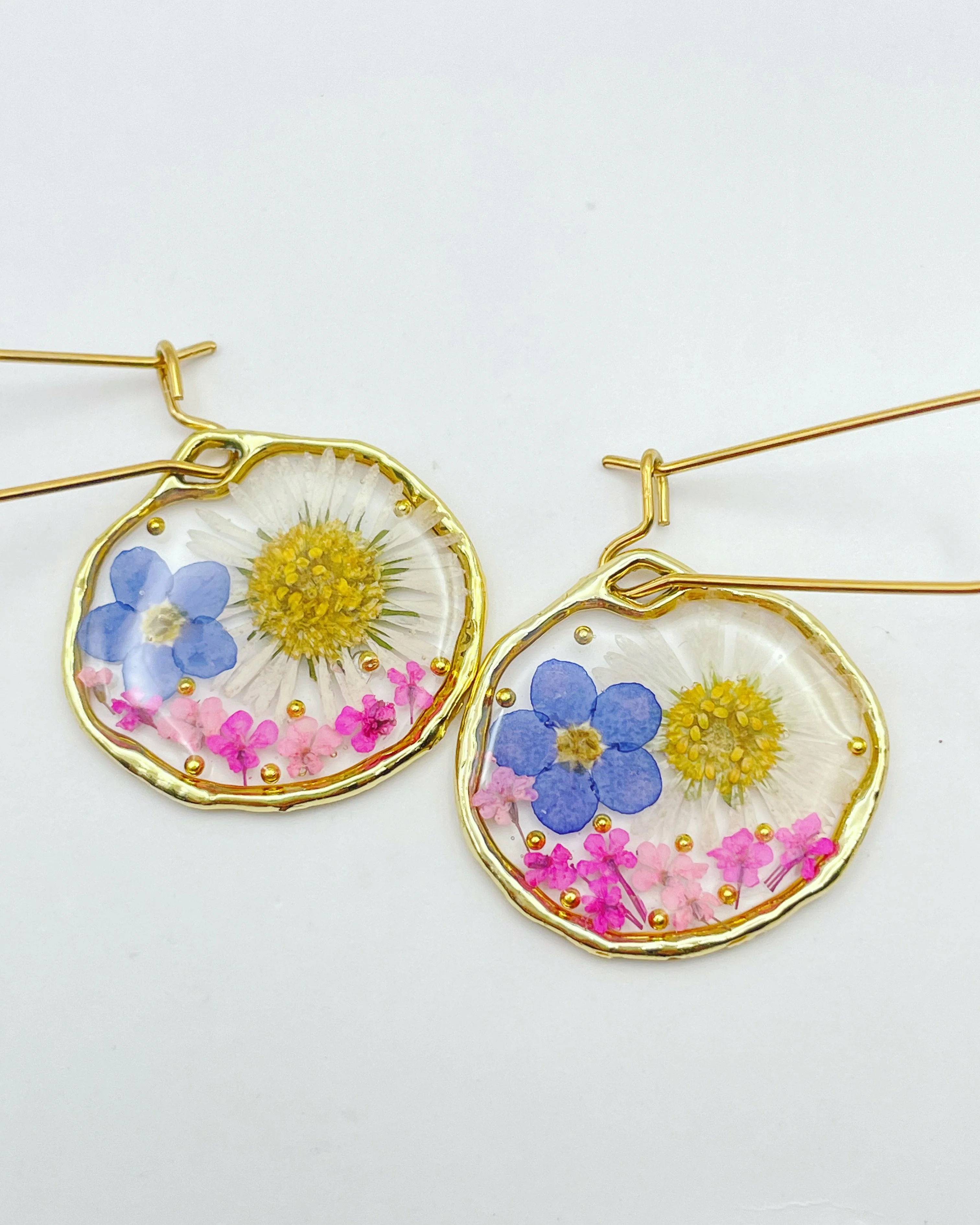 Earrings with daisy and forget me not flowers