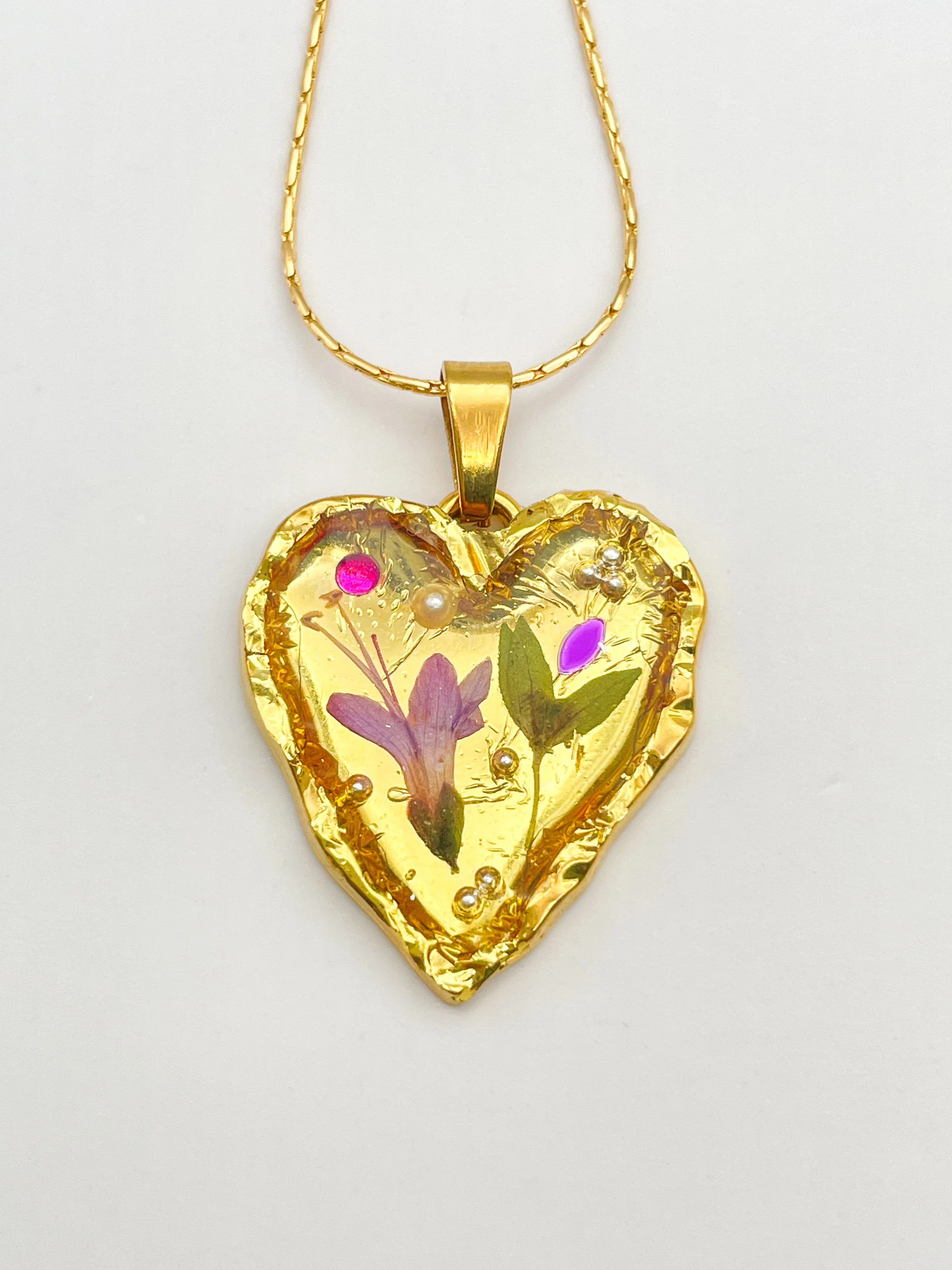 Gold heart necklace with lily flowers