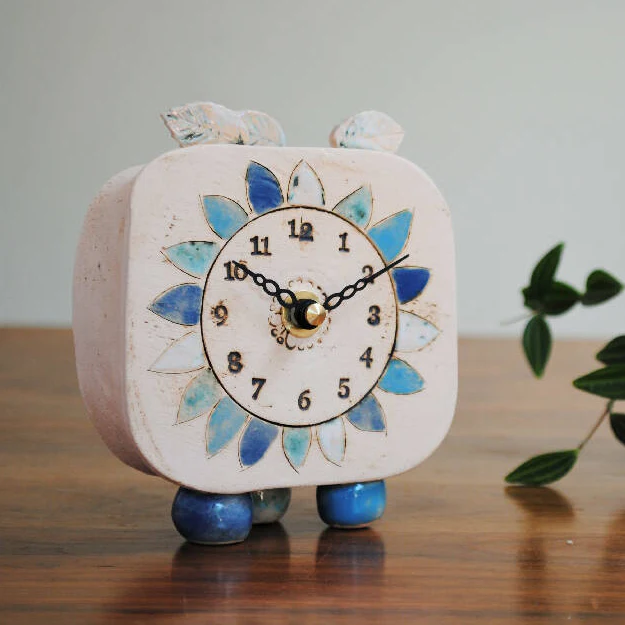 Small Handmade Clock With Pebble Feet and Blue Petals - Image 3