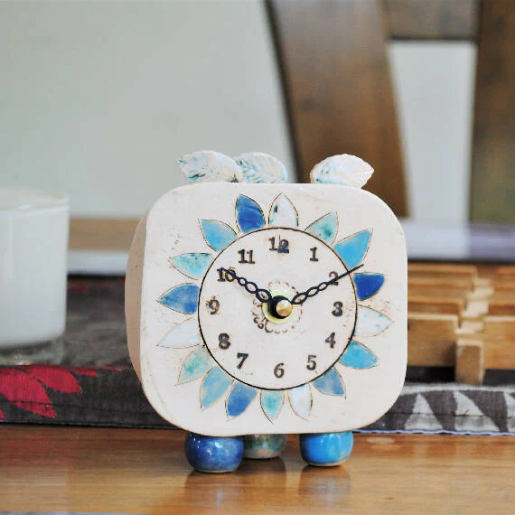 Small Handmade Clock With Pebble Feet and Blue Petals - Image 4