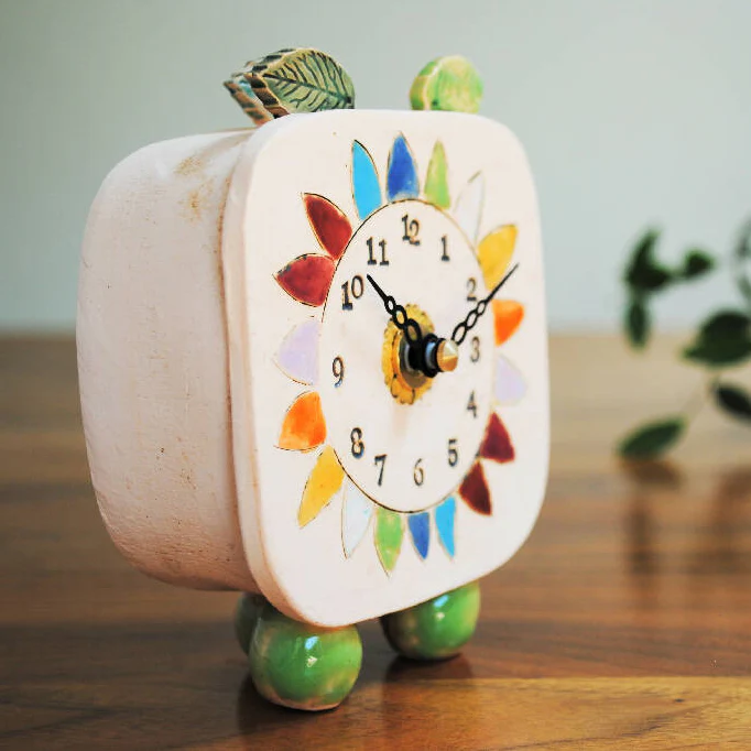 Small Handmade Clock with Pebble Feet and Rainbow Coloured Petals - Image 3