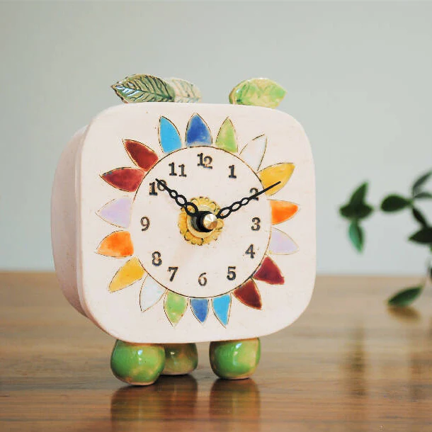 Small Handmade Clock with Pebble Feet and Rainbow Coloured Petals - Image 4