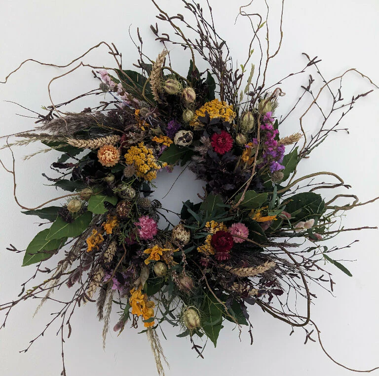 Spring Flower Wreath Decorated With Quals Eggs