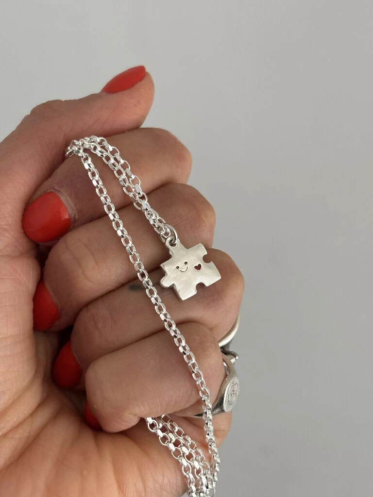 Sterling Silver Puzzle Charm Necklace with Red Heart