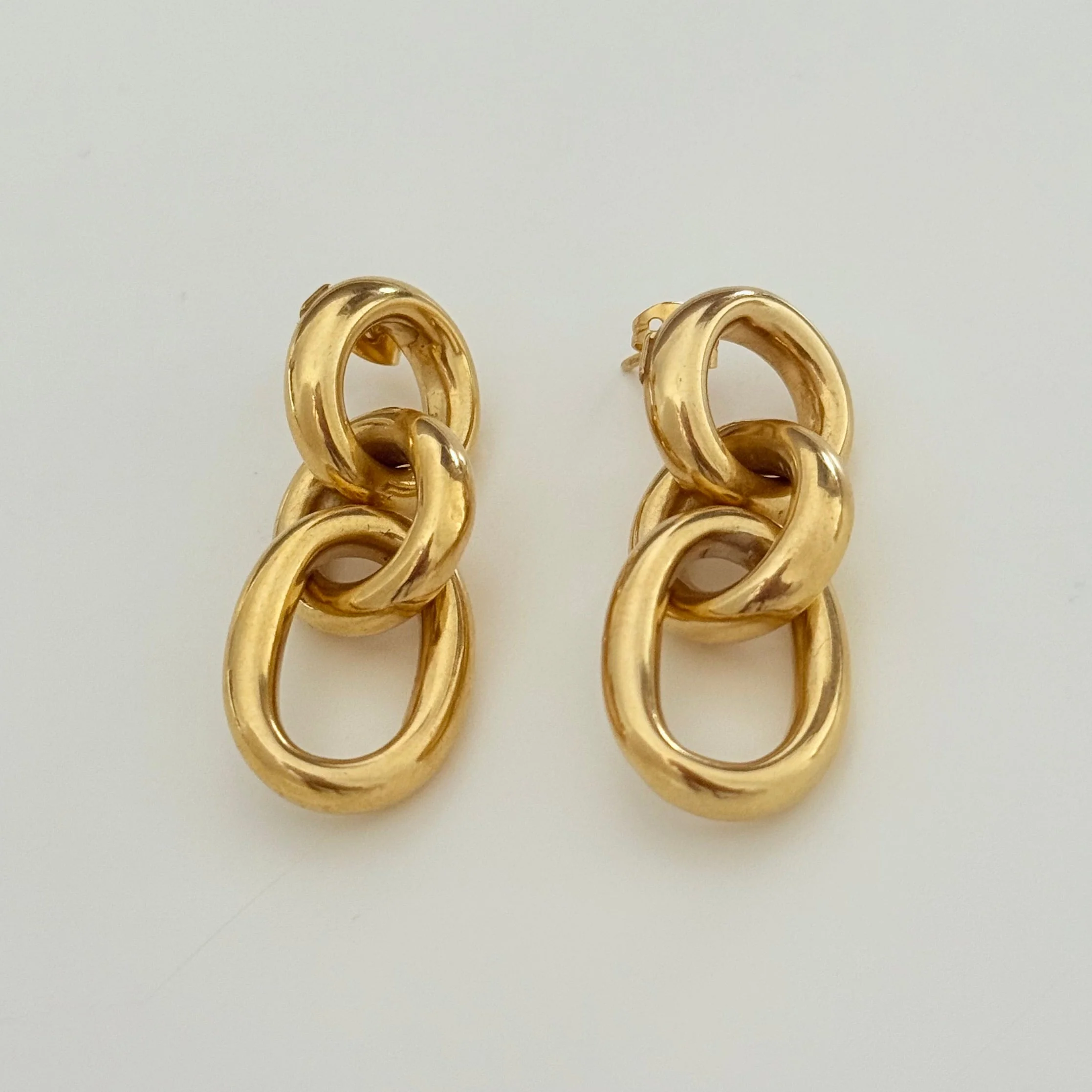 Three Small Interlinked Gold Plated Sterling Silver Oval Hoop Earrings